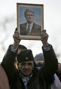 A protestor at a rally against Kosovo's declaration of independence holds up a picture of Radovan Karadžić, February 2008